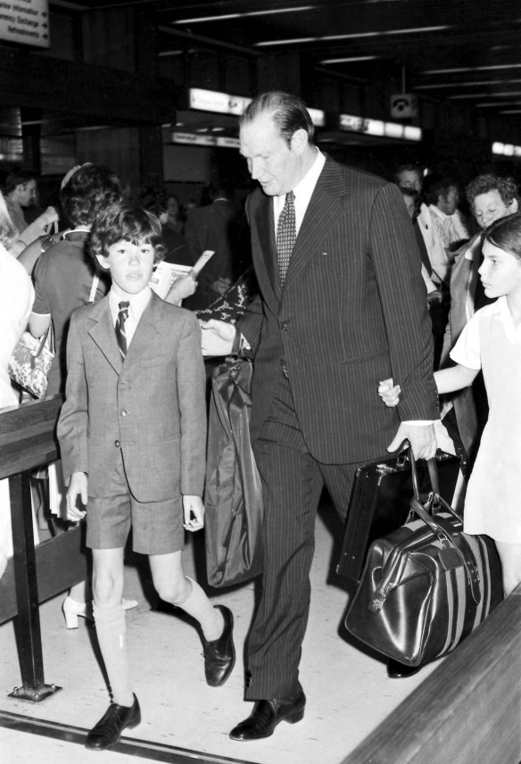 A young James Packer greets his father Kerry Packer at Sydney Airport in 1977, with big sister Gretel to the right. 