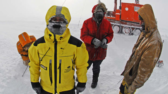 Workers setting up an automatic weather station in Antarctica.