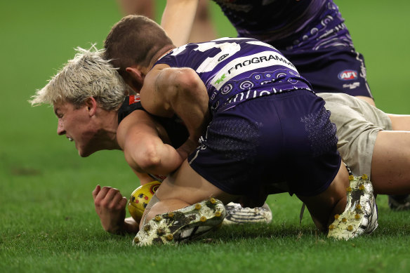 Sam Switkowski was suspended for a fortnight for his chicken wing tackle on Jack Ginnivan in 2022.