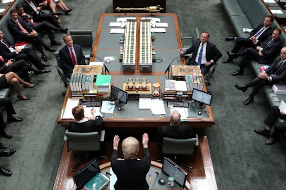 Opposition Leader Bill Shorten and Prime Minister Tony Abbott listen as Speaker Bronwyn Bishop delivers the valedictory in the House of Representatives at Parliament House in Canberra on Thursday 4th of December,  2014.
