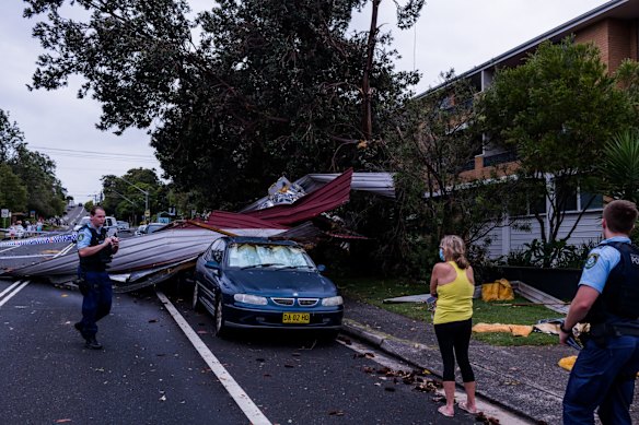 Emergency services personnel attend the scene after microburst on Griffin Rd Dee Why 