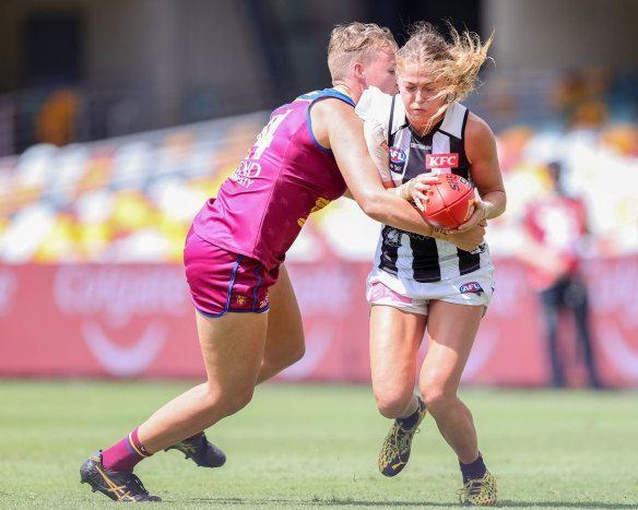 Dakota Davidson tackles Sarah Rowe.