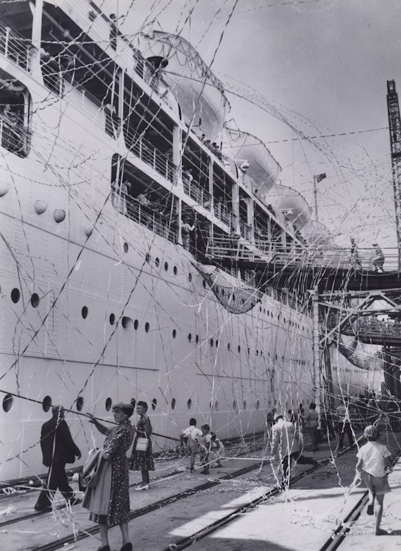 People with streamers farewelling cruise ship from port of Melbourne in 1960.