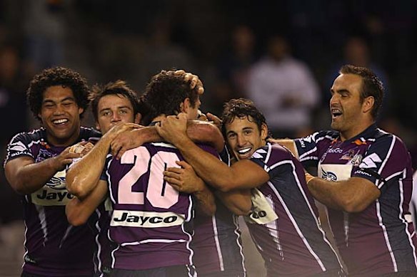 The Storm celebrate Matt Duffie's try. They went into half-time with a 22 point lead on the Warriors.