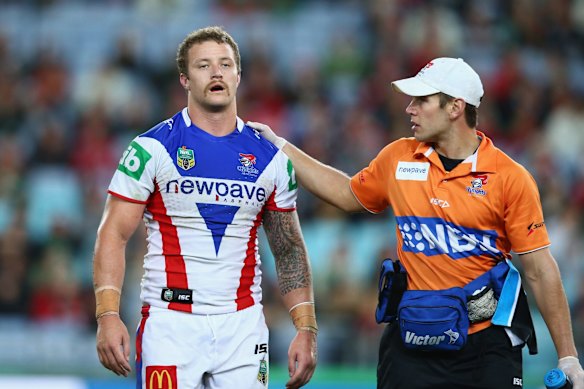 Where am I?: Korbin Sims of the Knights leaves the field with a trainer after a heavy knock.
