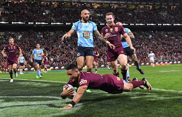Valentine Holmes of the Queensland Maroons scores.