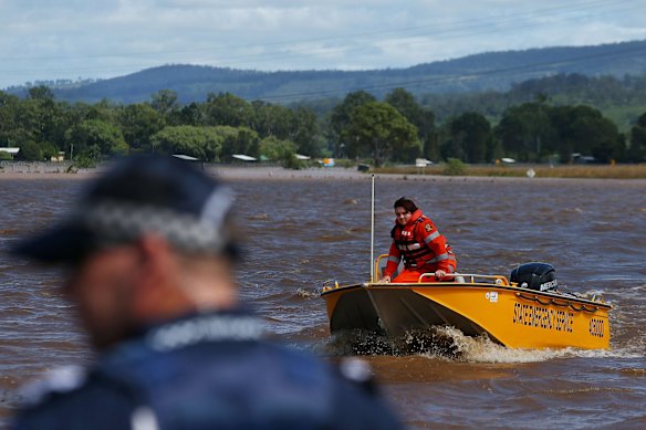 State Emergency Service workers help those affected by flooding in Beaudesert.