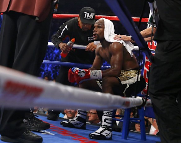 Floyd rests in his corner after the fourth round.