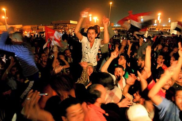 Egyptians residing in Sudan celebrate in the capital Khartoum after Egyptian president Hosni Mubarak steps down