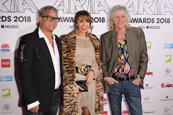 Jon Stevens (L), his girlfriend Heloise Pratt and Sir Bob Geldof.