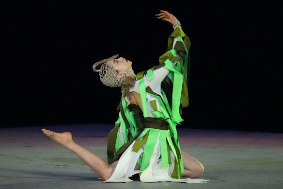 An artist performs during the closing ceremony in the Olympic Stadium at the 2020 Summer Olympics in Tokyo, Japan. 