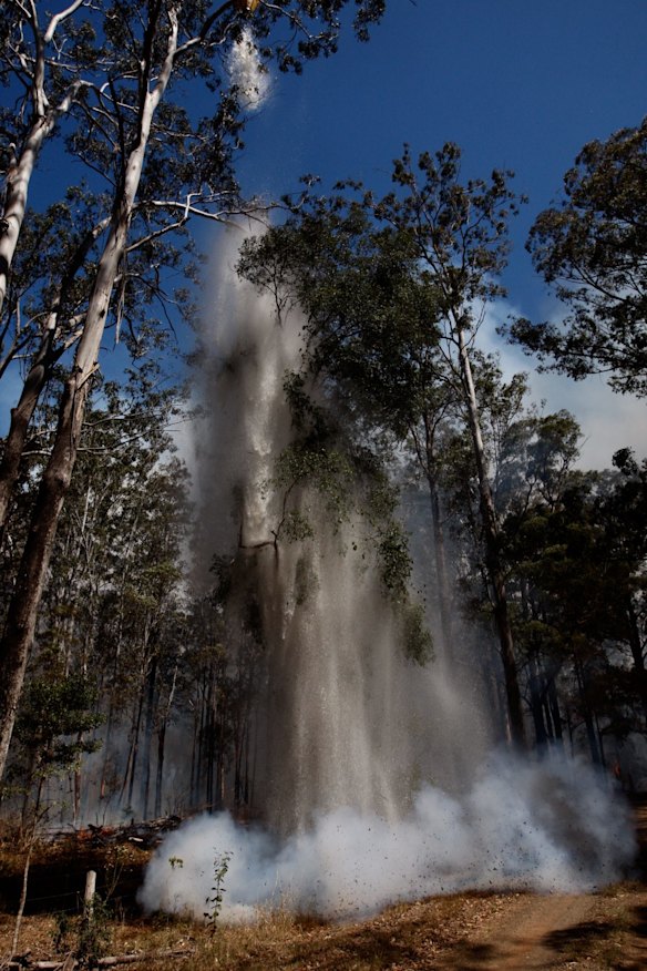 Photographs show water dumping after a flare up of the Hillville Fire near Hillville. 