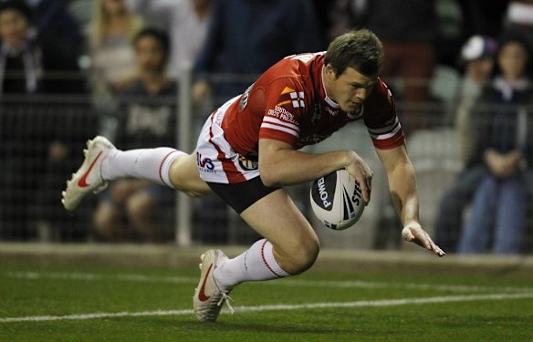 Dragons 2 Brett Morris makes a break away to score the opening try.
