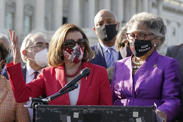 House Speaker Nancy Pelosi of Calif., speaks as Rep. Joyce Beatty, D-Ohio, listens on Capitol Hill in Washington, after the jury returned guilty verdicts on all three charges in the murder trial of former Minneapolis police Officer Derek Chauvin in the death of George Floyd. 