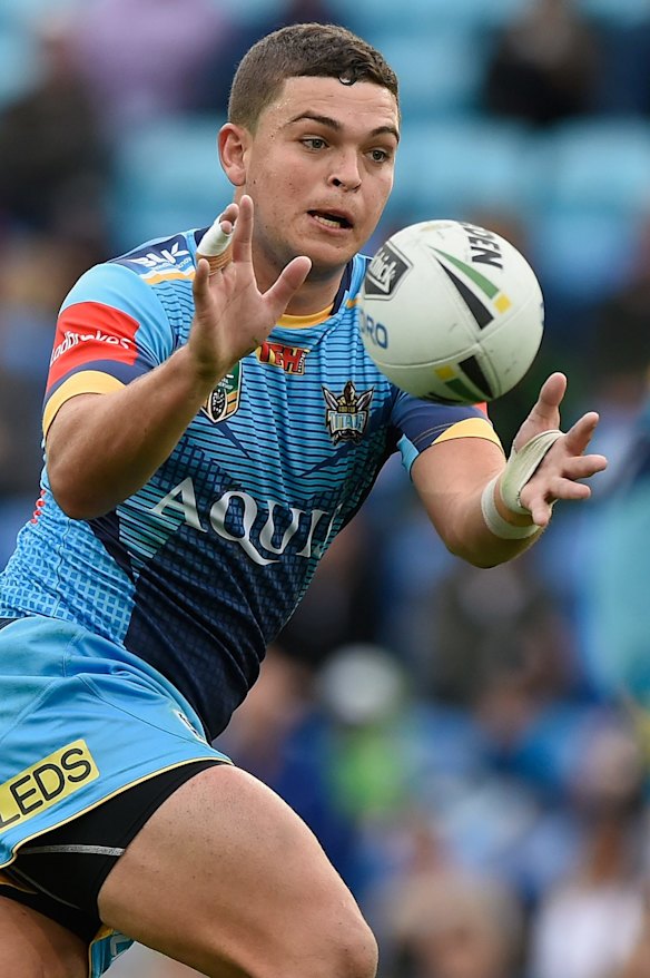 Ash Taylor of the Titans receives a pass.