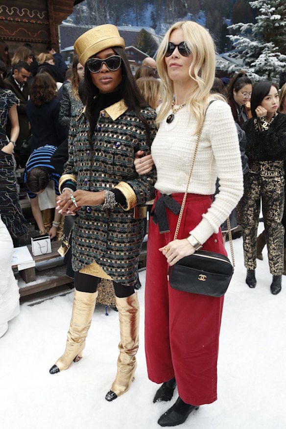 Models Claudia Schiffer, right, and Naomi Campbell pose for photographers upon arrival at the Chanel ready to wear Fall-Winter 2019-2020 collection, that was presented in Paris, Tuesday, March 5, 2019. (AP Photo/Thibault Camus)
