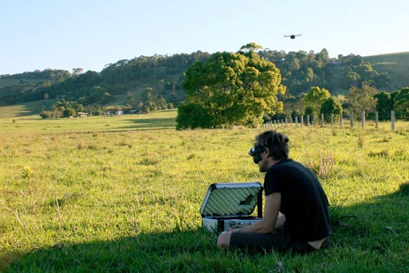 A drone in action (top right), with its pilot in control.