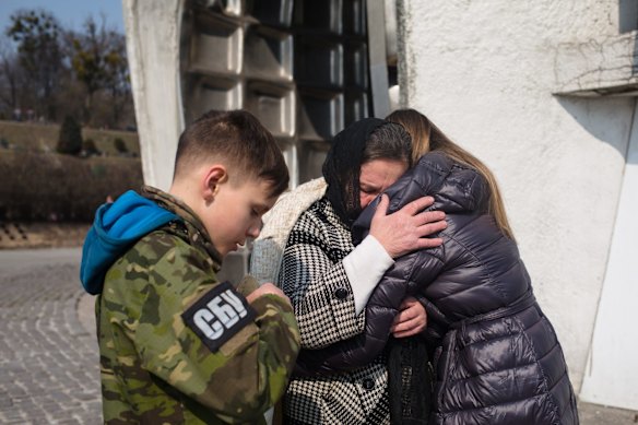 Liudmyla, the mother of Ukrainian serviceman Vladyslav Buvalkin, 42, who was killed in action, and his son, Daniil, 11.