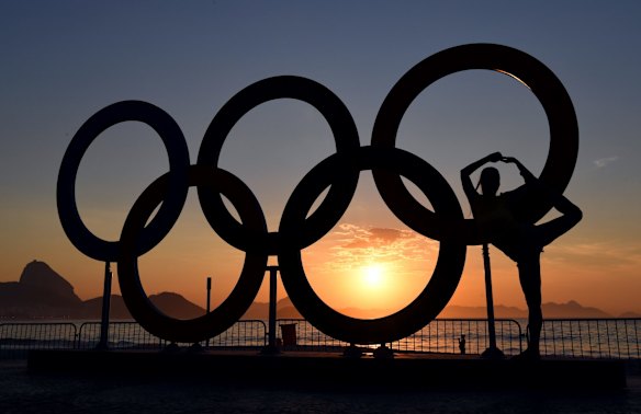 The Olympics rings at sunrise on Copabana Beach.