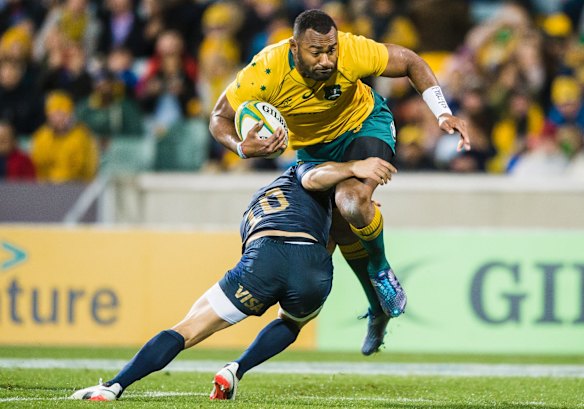 Wallabies outside centre Tevita Kuridrani is caught by Pumas flyhalf Nicolas Sanchez. 