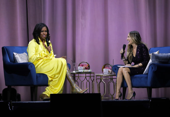 Former first lady Michelle Obama (left) who read her own audio version, talks to actor Sarah Jessica Parker about “Becoming: An Intimate Conversation with Michelle Obama”.