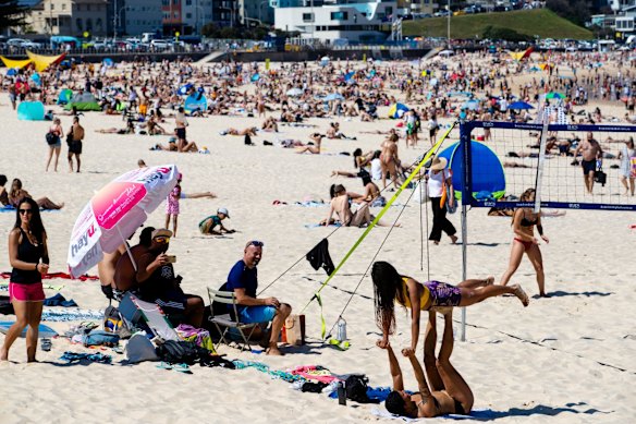 People enjoying the long weekend at Bondi Beach.