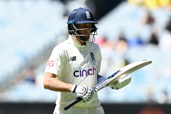 Joe Root of England looks dejected while leaving the field of play after being dismissed by Scott Boland of Australia.