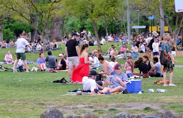 People relaxing at Edinburgh Gardens in Fitzroy
