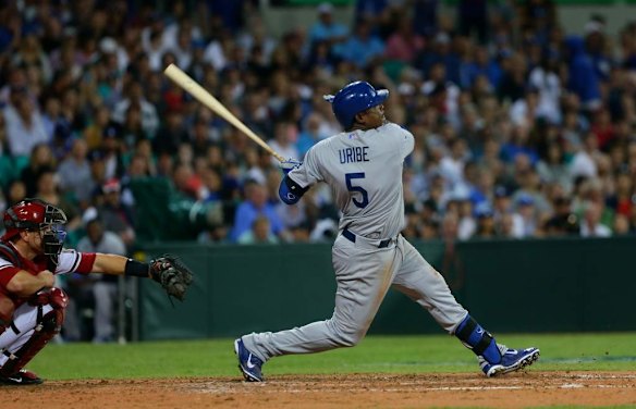 Dodgers Juan Uribe hits a fly ball in the Opening Game of the 2014 MLB Season Between the Arizona Diamonbacks and LA Dodgers at the SCG.