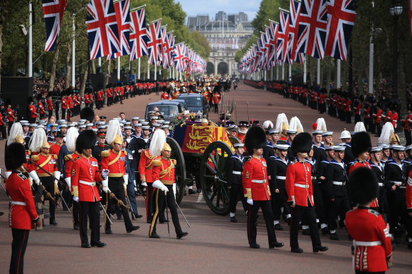 The Queen’s funeral cortege borne on the State Gun Carriage of the Royal Navy travels along the Mall.