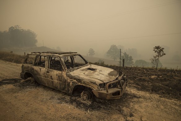 A burnt out vehicle on the fireground in Taylors Arm near Macksville in northern NSW.
