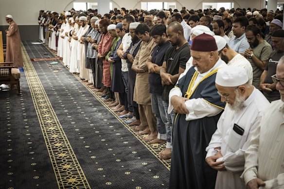 People pray for those affected by the earthquakes at the Melbourne Grand Mosque in Tarneit on Friday.