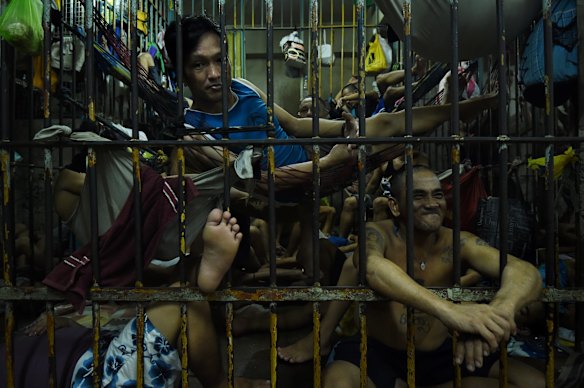 Prisoners are cramped inside an overcrowded cell in Manila Police Headquarters. 