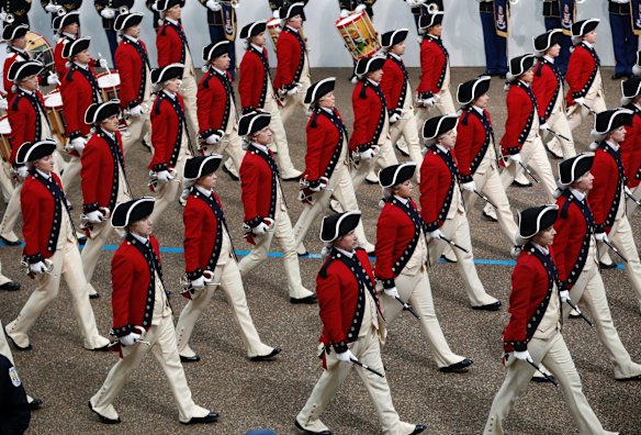 Military units march during the 58th Presidential Inauguration parade for President Donald Trump in Washington.
