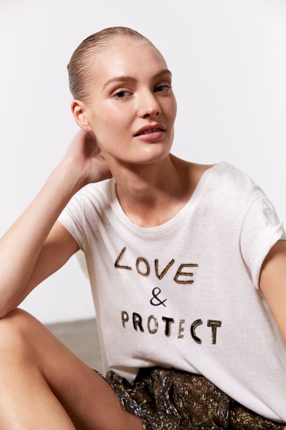 Model wearing Love &amp; Protect tee.