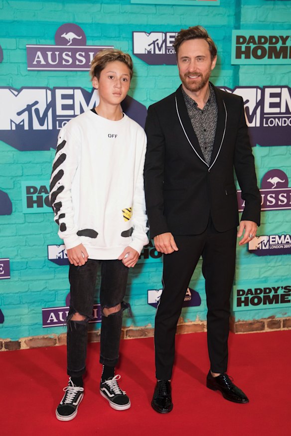 French DJ David Guetta, right, poses for photographers with his son Elvis upon arrival at the MTV European Music Awards 2017/