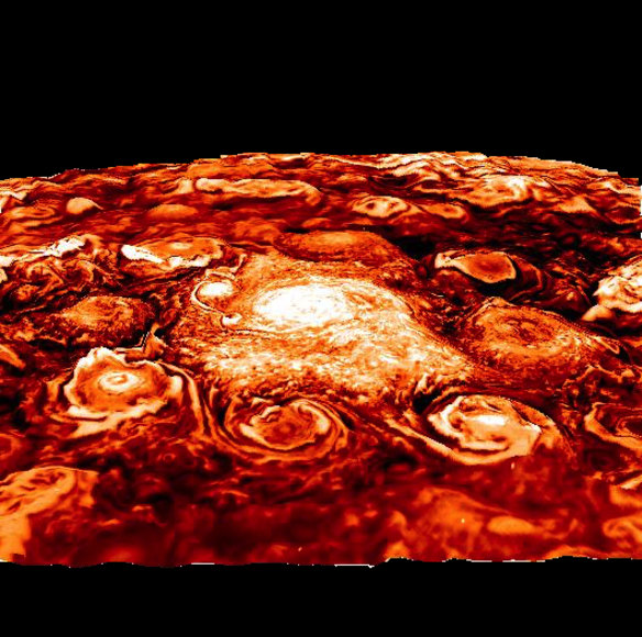 This CG image shows the cyclones spinning on Jupiter's north pole. It was shot using infrared, and then coloured in.