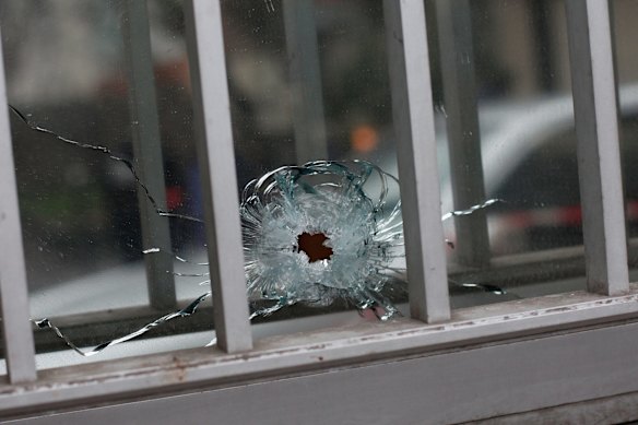 Bullet damage in the window of a building next to the Charlie Hebdo office.