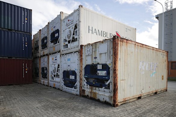 Shipping containers await removal.