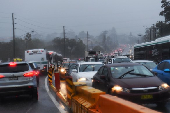 Traffic on Warringah road, Frenchs Forest after flooding reduced the Roseville bridge to one lane.