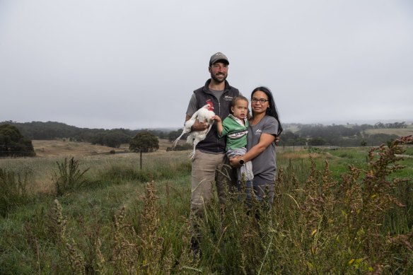 Luke and Pia Winder with their son at Tathra Place Free Range. The family-run farm supplies high-end restaurants including Quay and Aria.