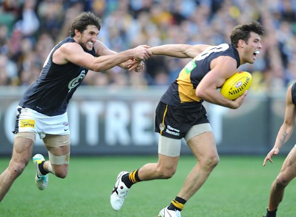 Richmond's Alex Rance is tackled by Carlton's Jarrad Waite.