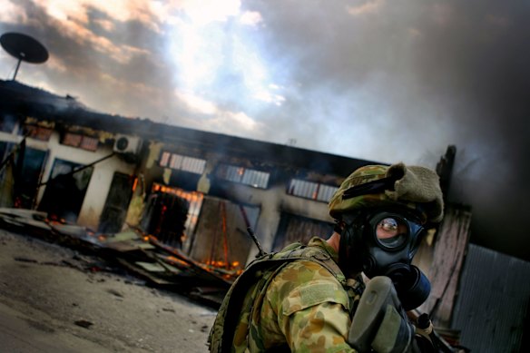 East Timor's capital city Dili is ablaze with sporadic fires across the city, lit by gangs as the country struggles with fighting between the military and east versus west supporters.  27 May 2006