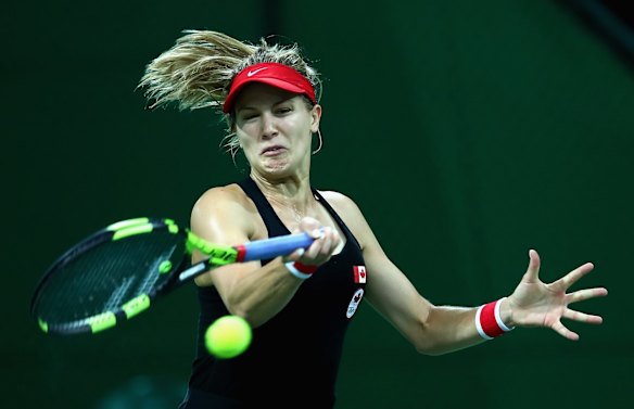 Eugenie Bouchard of Canada plays a forehand against Sloane Stephens of the United States.