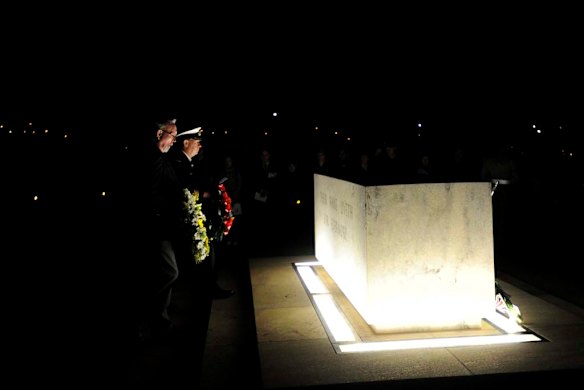 Mr David Knight, ACT Branch RSL, and Commander David Hedgley RNZN, Acting Defence Adviser, New Zealand High Commission,  place wreaths on the Stone of Remembrance during the ANZAC Day dawn service at the Australian War Memorial in Canberra.