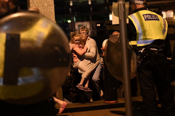 People are lead to safety on Southwark Bridge away from London Bridge after an attack.