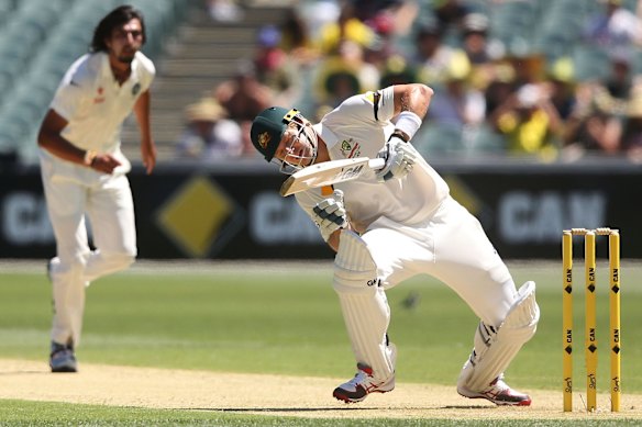 Shane Watson gets off balance after receiving a bouncer from Ishant Sharma.