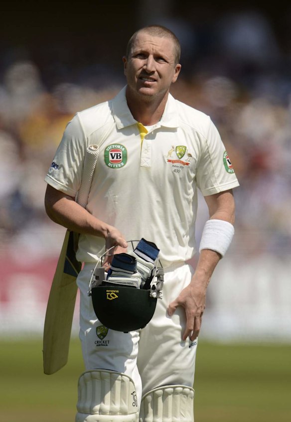 Australia's Brad Haddin leaves the field after being dismissed by England's Graeme Swann.