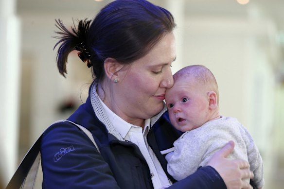 Liberal MP Kelly O'Dwyer with her 12-week-old daughter Olivia, arrive at Canberra Airport ahead of the Parliamentary sitting week, on Sunday 9 August 2015. Photo: Alex Ellinghausen