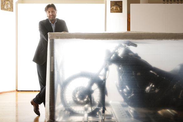 Under wraps: National Film and Sound Archive CEO Jan Müller with Heath Ledger's Harley- Davidson. 